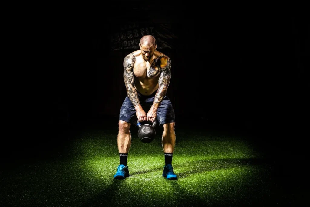 Strength Training and Functional Training: Unveiling the Differences 3 man does functional training with kettlebells for strength and endurance.