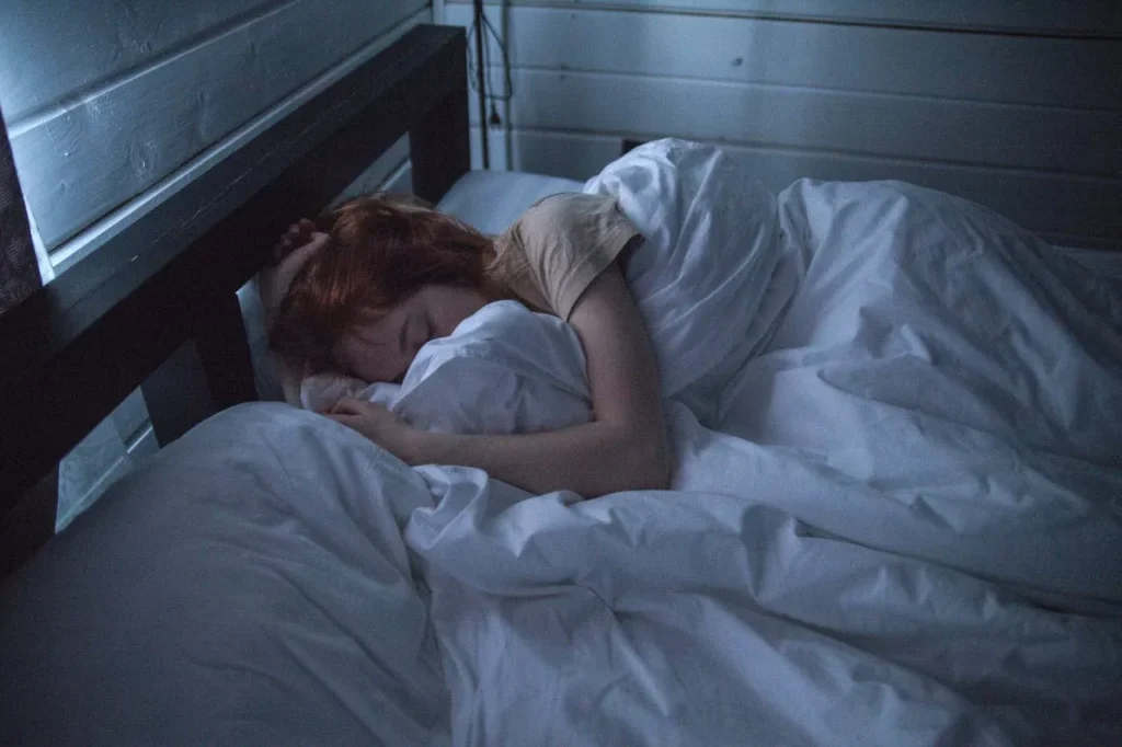 Discover 7 Powerful Exercise Benefits for Mental Health 6 woman sleeping in dimly lighted bedroom