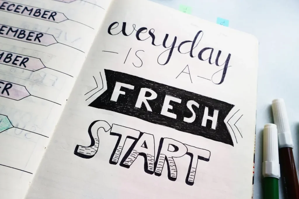 Starting Exercise at 40: 7 Essential Tips To Revolutionize Your Life 12 motivational journal that says, "every day is a fresh start."