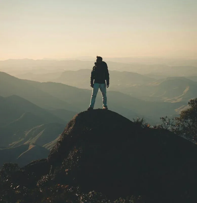 What is Strength: 6 Essential Elements 6 man in nature standing on top of a mountain