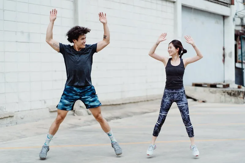 10 Simple Home Workouts for Beginners to Boost Fitness and Strength! 2 a fit couple doing jumping jacks