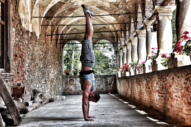 Unlock Calisthenics Strength: 3 Calisthenics Routines 17 man demonstrating a handstand with perfect form