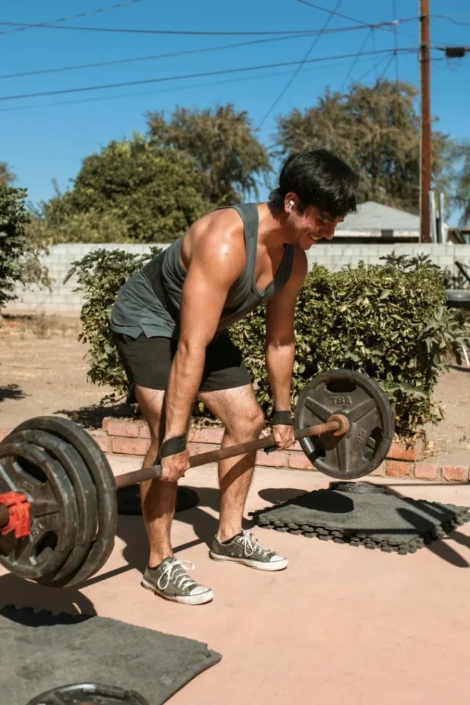 Starting Exercise at 40: 7 Essential Tips To Revolutionize Your Life 6 a smiling man doing deadlifts outside