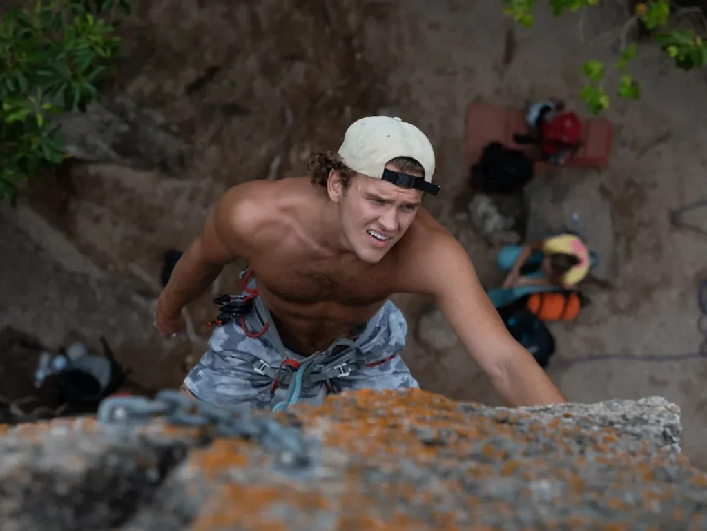 Discover 7 Powerful Exercise Benefits for Mental Health 9 man mountain climbing