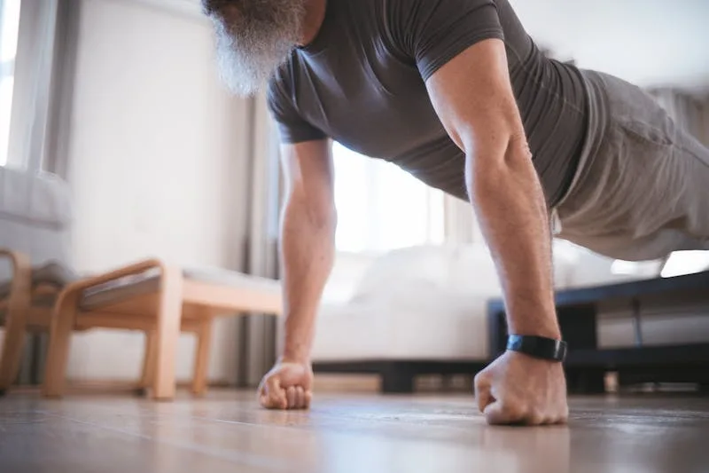Bodyweight Exercises: 7 Incredible Workouts to Transform Your Fitness 3 man performing push-ups on fists