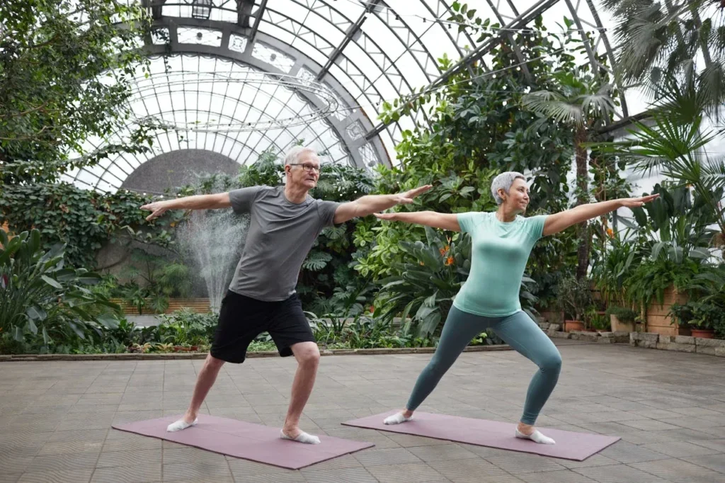 Calisthenics for Seniors: 7 Powerful Exercises to Boost Strength and Vitality 2 two seniors demonstrating calisthenics for seniors with beginning stretches