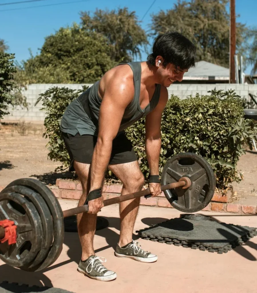 Functional Fitness for Everyday Life: 5 Essential Moves to Supercharge Your Health 7 smiling man doing deadlifts
