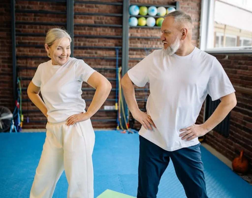 Calisthenics for Seniors: 7 Powerful Exercises to Boost Strength and Vitality 11 senior couple cooling down after a calisthenics for seniors workout