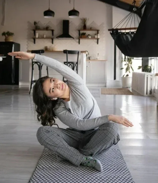 Strength Training Tips for Women: 10 Essential Strategies to Transform Your Fitness 5 woman stretching at home