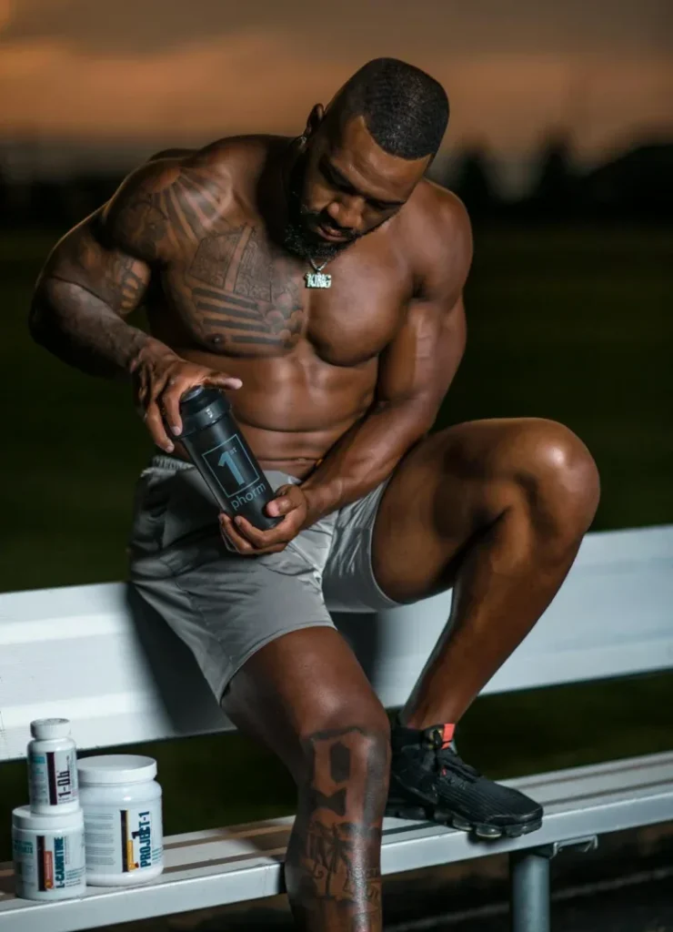 10 Incredible Protein Supplements for Strength Training: Maximize Your Gains 2 protein supplements for strength training - muscular man taking supplements