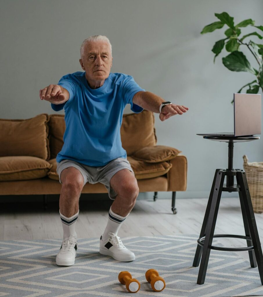 Calisthenics for Seniors: 7 Powerful Exercises to Boost Strength and Vitality 5 senior man doing air squats at home