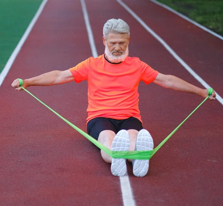 Safe Workout Tips for Those with Chronic Pain: 7 Empowering Strategies to Start Today 5 older man working out with flex bands