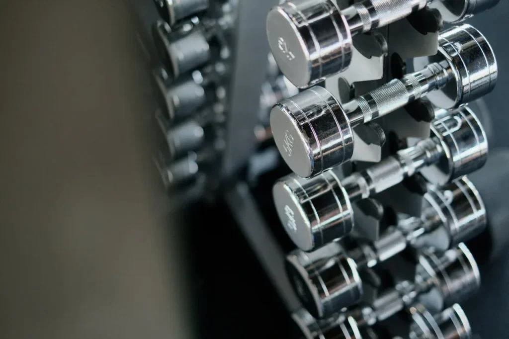 Strength Training Tips for Women: 10 Essential Strategies to Transform Your Fitness 6 image of a very orderly stack of weights