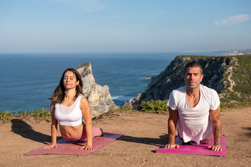 10 Incredible Protein Supplements for Strength Training: Maximize Your Gains 6 fit couple performing yoga outdoors