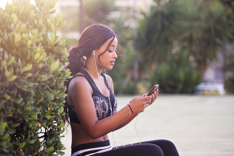 Best Digital Workout Programs: Transform Your Fitness Journey Today 2 woman using best digital workout programs in park to exercise