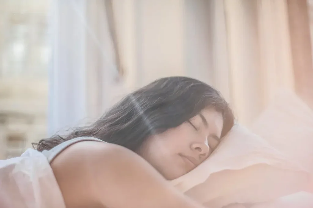 The Easy Way to Lose Weight Fast for Beginners: 7 Powerful Steps to Success 6 girl sleeping in warmly lit bedroom