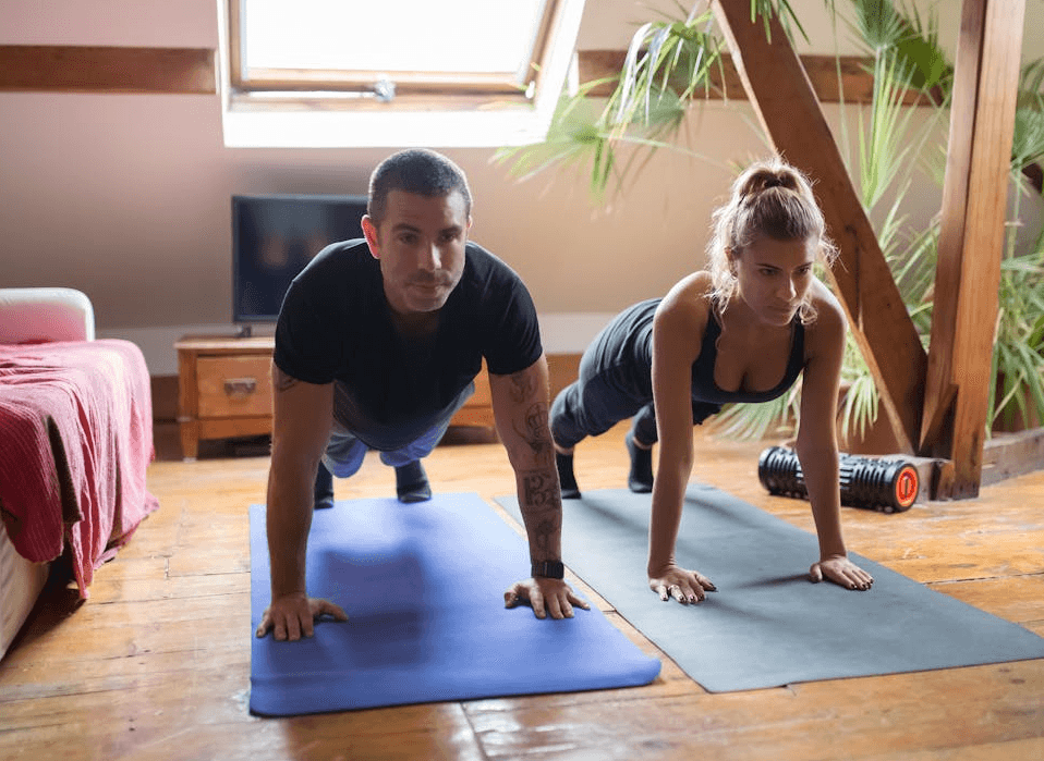 Transform Your Fitness: Quick 15-Minute Home Workouts for Busy People 2 a couple doing home workouts for quick 15-minute home workouts for busy people