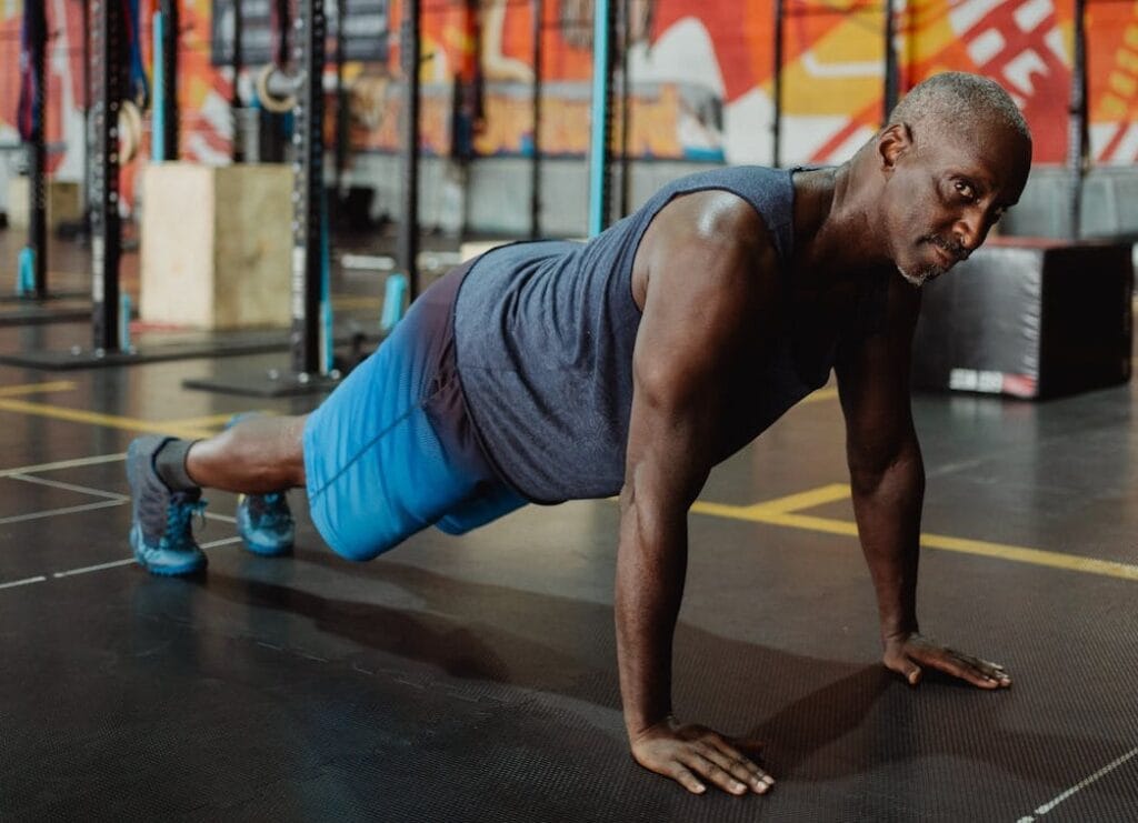 7 Proven Steps to Mastering 100 Push-ups in a Row 5 man confidently doing push-ups in a gym
