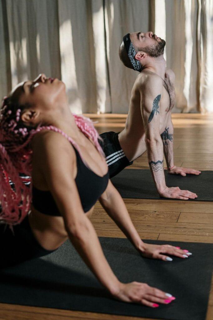 Transform Your Fitness: Quick 15-Minute Home Workouts for Busy People 5 a couple doing yoga together at home