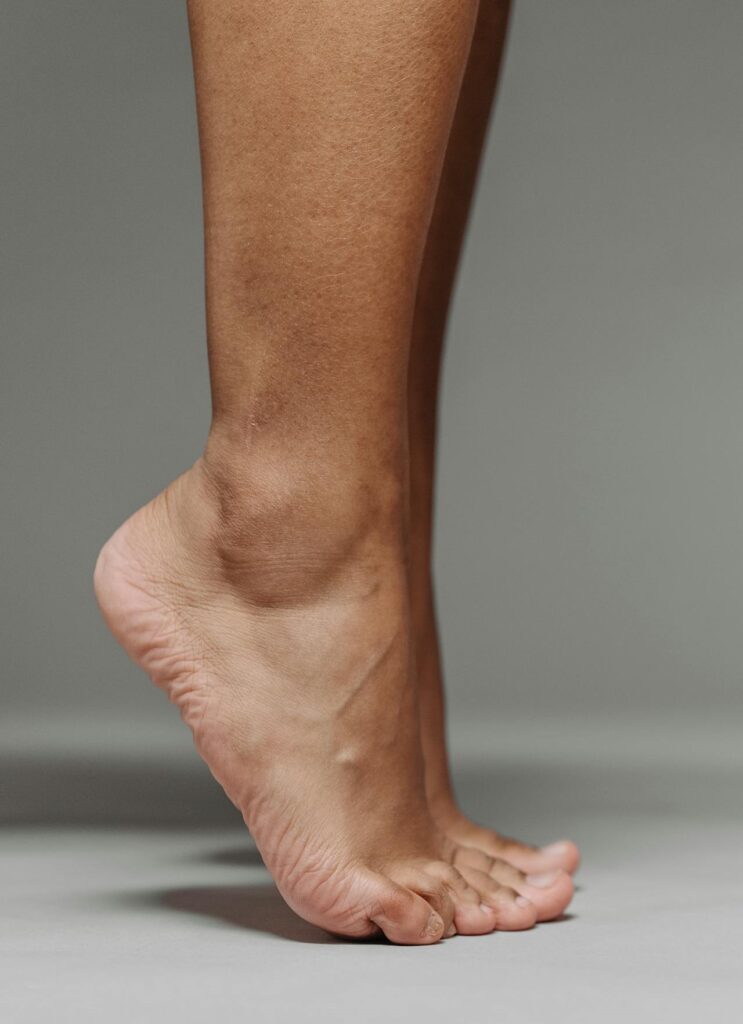 Get Strong, Stay Strong: Senior Workouts Without Equipment 6 image of a woman's feet doing calf raises
