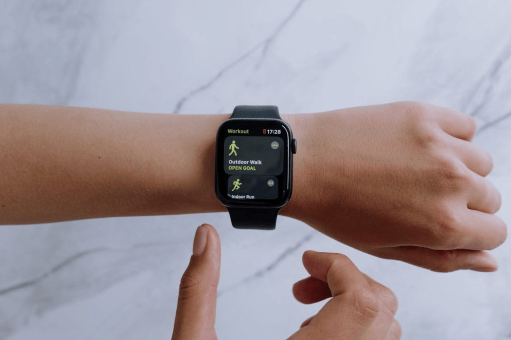 How to Lose Belly Fat Naturally: A Proven Guide to Success 5 image of an arm with a fitness app watch on the wrist