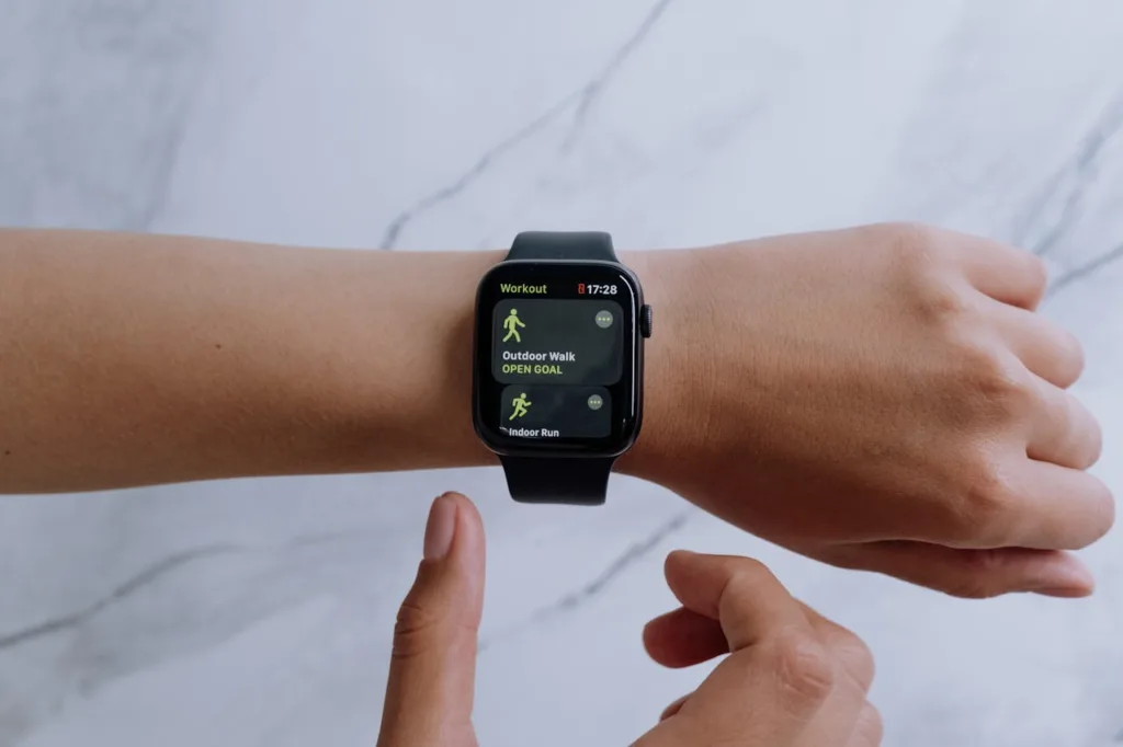image of an arm with a fitness app watch on the wrist
