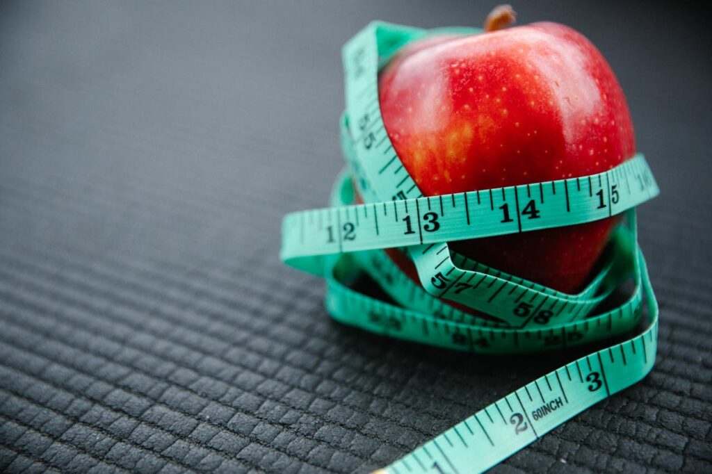 How to Lose 10 Pounds in 2 Weeks: Your Ultimate Guide to Quick Results 4 a healthy apple with measuring tape around it signifying weight loss by healthy eating habits