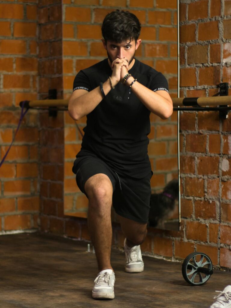 7 Powerful Hotel Workouts Without Equipment to Keep You Fit on the Go! 5 man doing lunges in a basic gym