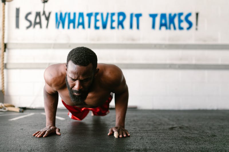 3 Powerful Calisthenics Exercises: Why Push-Ups, Pull-Ups, and Squats Are All You Need 2 man demonstrating a calisthenics exercise by doing pushups
