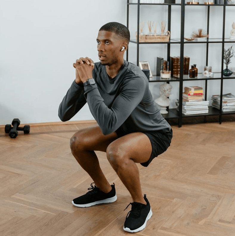 Calisthenics Plan for Beginners: 10 Incredible Steps to Get Started 4 man demonstrating perfect form air squats
