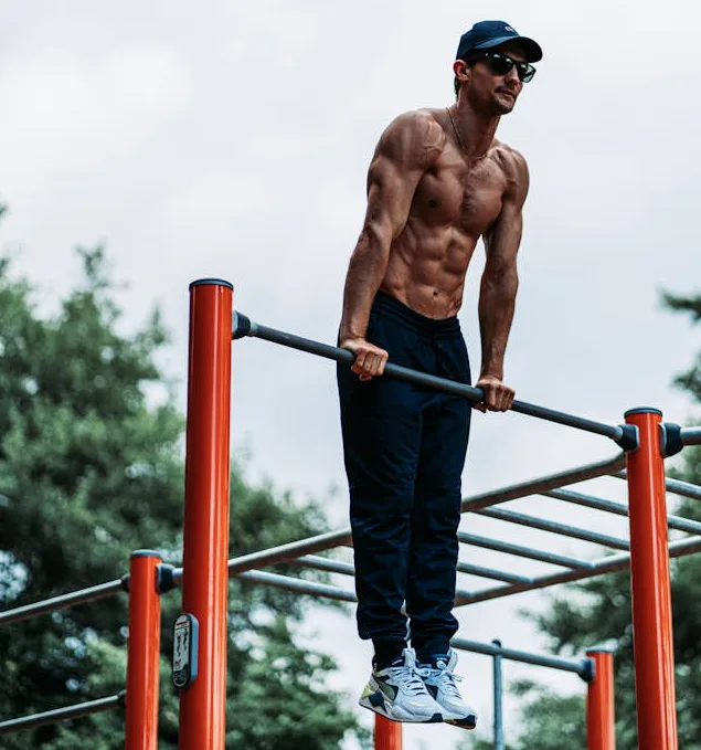 man demonstrating a muscle up which is an advanced calisthenics movement