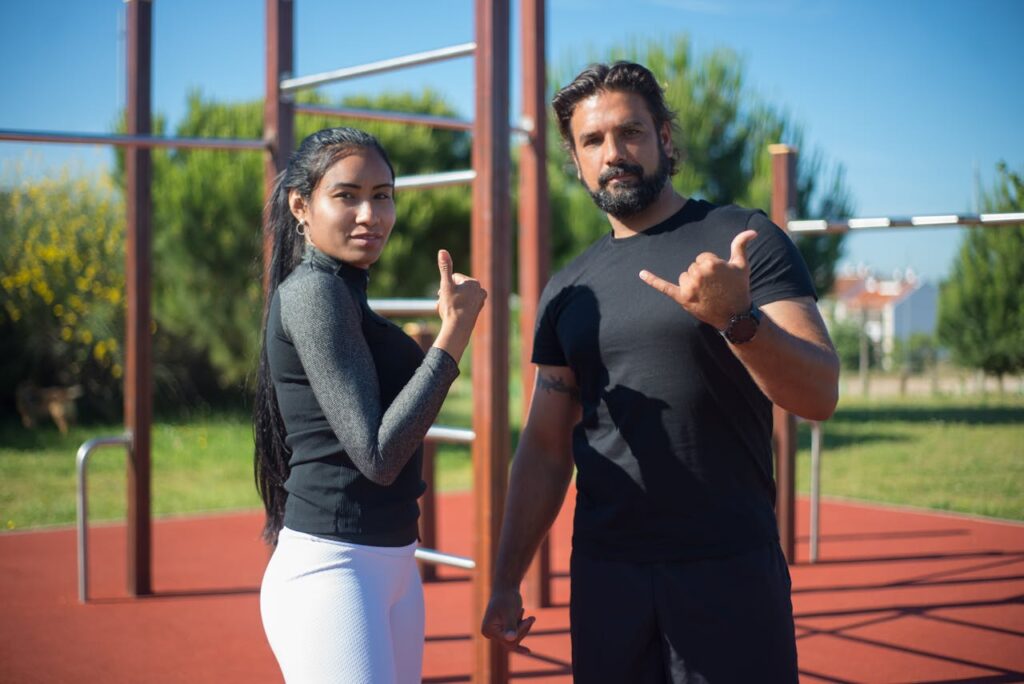 Full-Body Bodyweight Workout: A Dynamic 5 Step Plan 8 happy couple giving the "hand loose" and thumbs-up symbol after a good bodyweight workout
