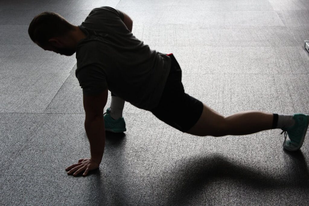 Full-Body Bodyweight Workout: A Dynamic 5 Step Plan 5 shadowed figure of a man doing a lunge stretch