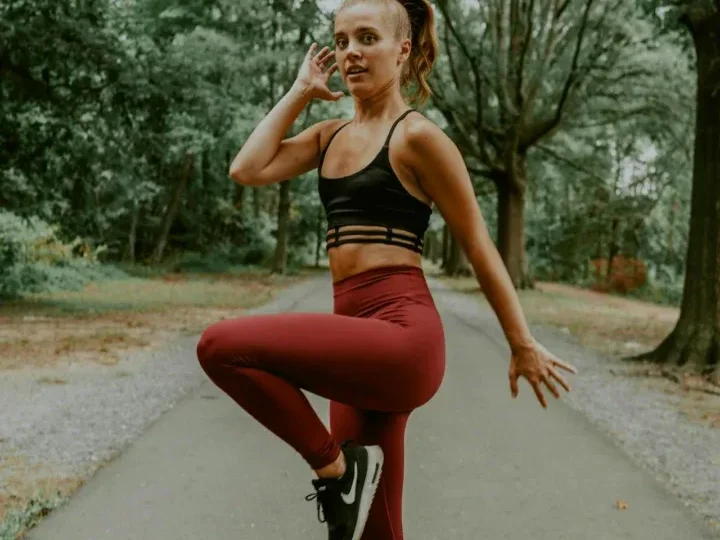 10 Simple Home Workouts for Beginners to Boost Fitness and Strength! 8 woman in scenic area doing high knee exercises