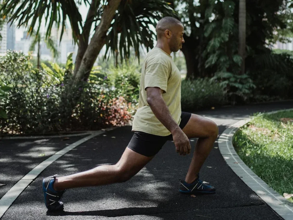 10 Simple Home Workouts for Beginners to Boost Fitness and Strength! 7 man in park doing lunges