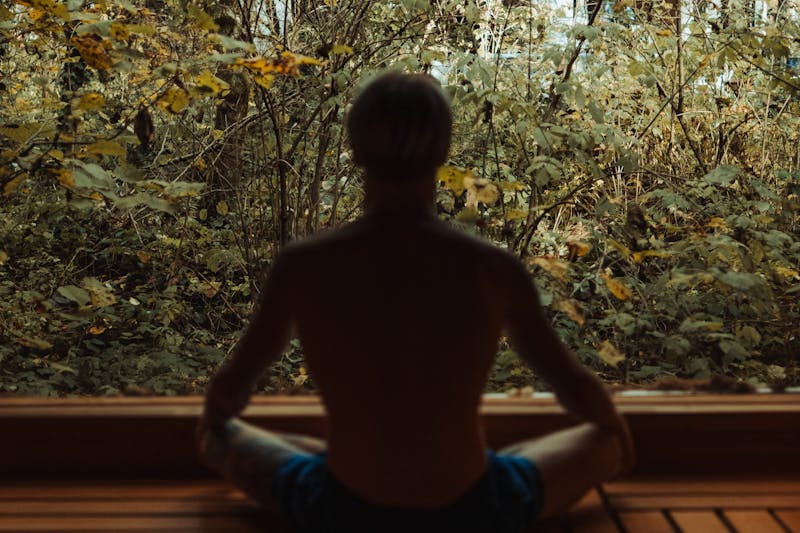 The Psychology Behind Weight Loss: 10 Powerful Mindset Shifts for Lasting Results 7 image of person in silhouette seated in an outdoor environment in a thoughtful manner