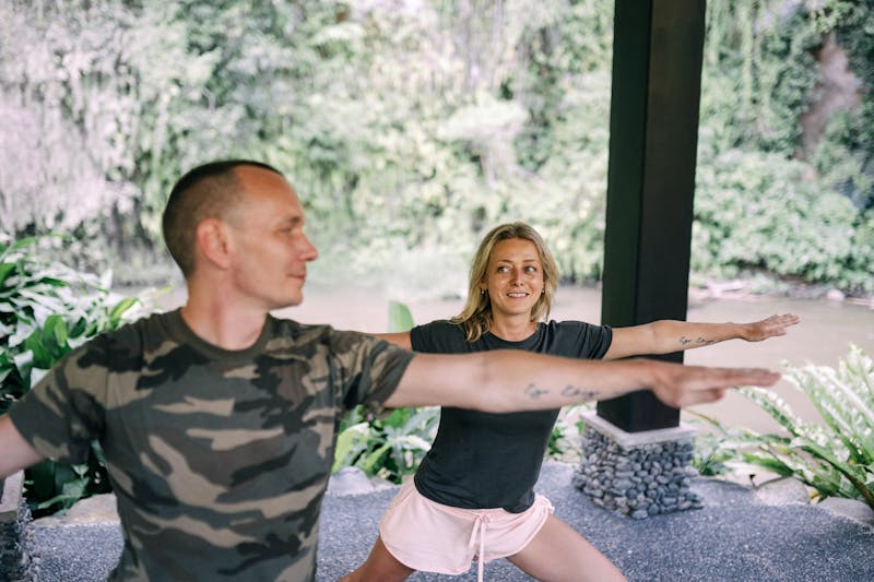 Why Slow Metabolism and Weight Loss Get Harder as We Age: Unlock 3 Powerful Solutions for Lasting Results 3 image of a fit couple stretching and warming up to exercise