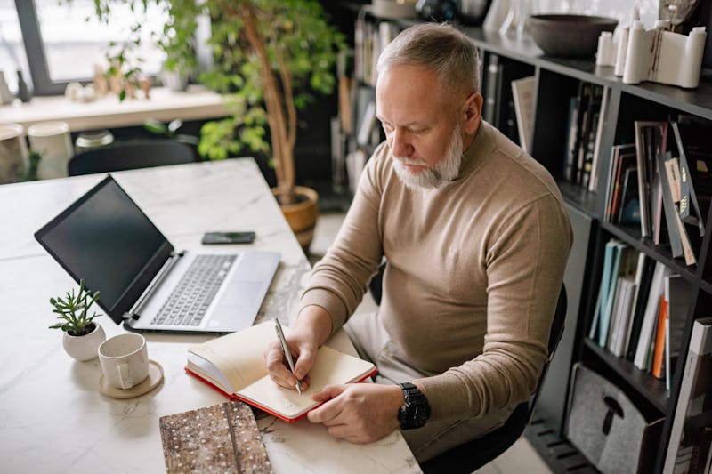 The Psychology Behind Weight Loss: 10 Powerful Mindset Shifts for Lasting Results 4 image of a thoughtful man writing in a journal
