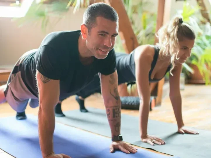 Functional Fitness for Everyday Life: 5 Essential Moves to Supercharge Your Health 6 a fit couple doing pushups