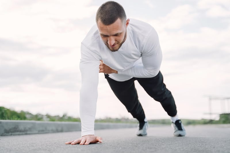 Unlock Functional Strength: 7 Powerful Beginner Exercises for Real-World Strength 4 man doing shoulder touch planks