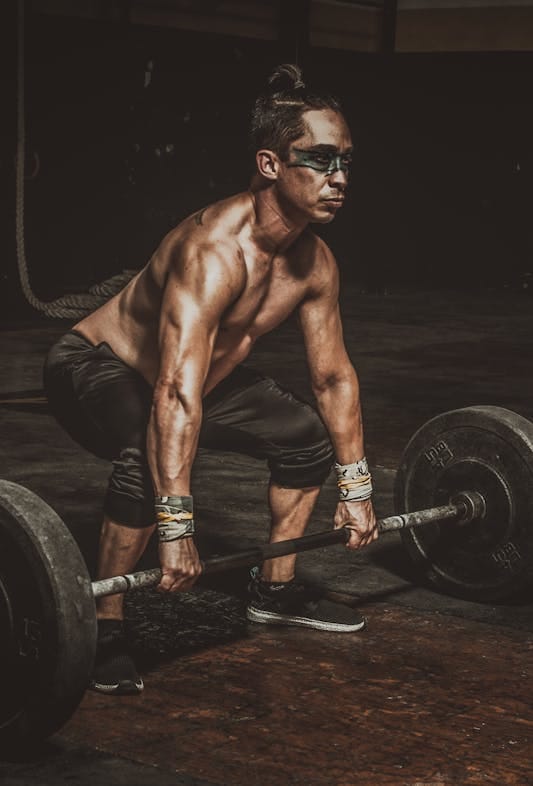 Farmer Strength Training: 6 Powerful Moves for Total Body Strength 5 man performing a heavy deadlift