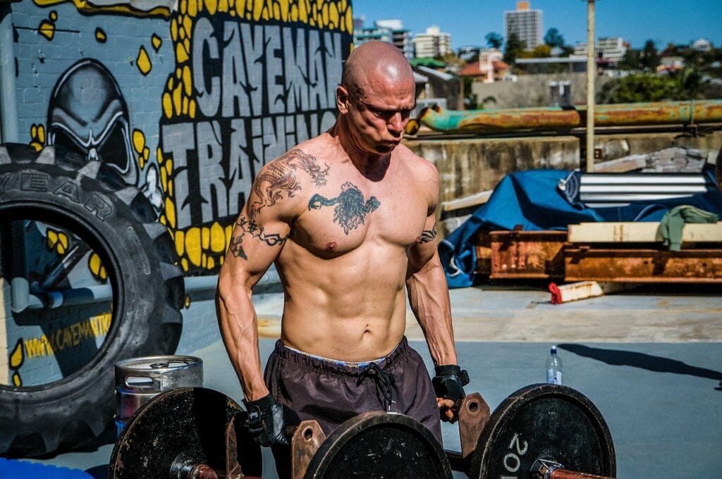 7 Powerful Functional Fitness Moves for Tough Times 4 man performing the farmer carry
