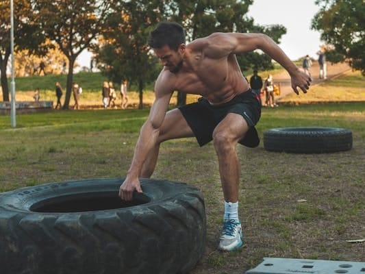 Survival Fitness: Master Your Life and Thrive when SHTF 2 man lifting tractor tire for functional strength and survival fitness