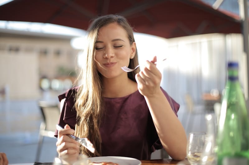 Can You Lose Weight Without Exercise? Discover Proven Strategies! 4 woman eating focusing on her meal