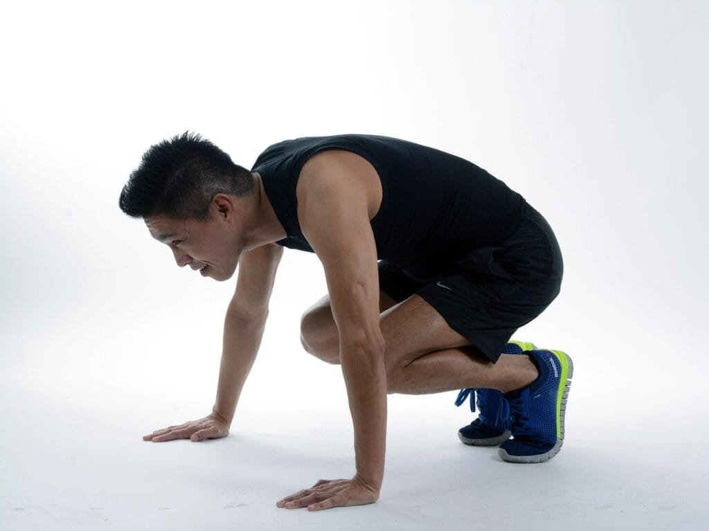 7 Powerful Functional Fitness Moves for Tough Times 5 man showing the middle portion of the burpee movement