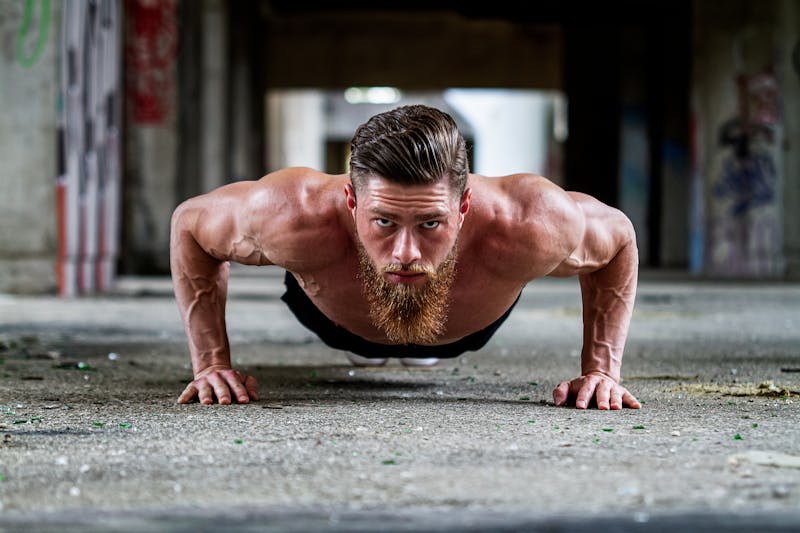 The Ultimate Calisthenics FAQ: Everything You Need to Know About Bodyweight Training 3 man performing calisthenics pushups