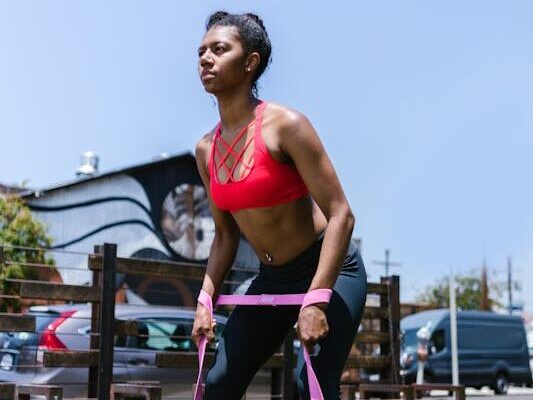 Minimalist Strength Training: 5 Myths Debunked 3 woman demonstrating squats with resistance band