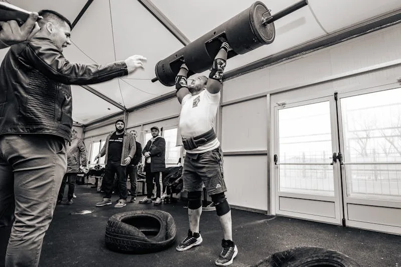 strongman contest overhead log press