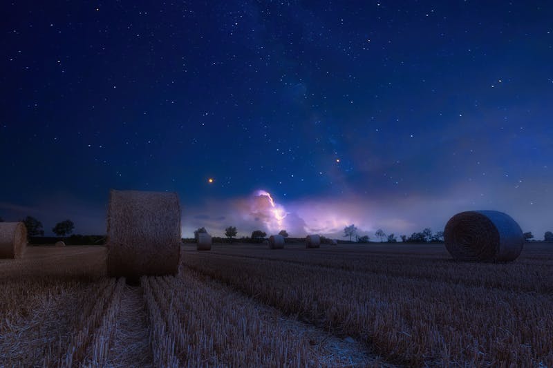 Unlock Farmer Strength: The Rugged Blueprint for Real-World Power 8 the hayfield at night with beautiful clouds in the background