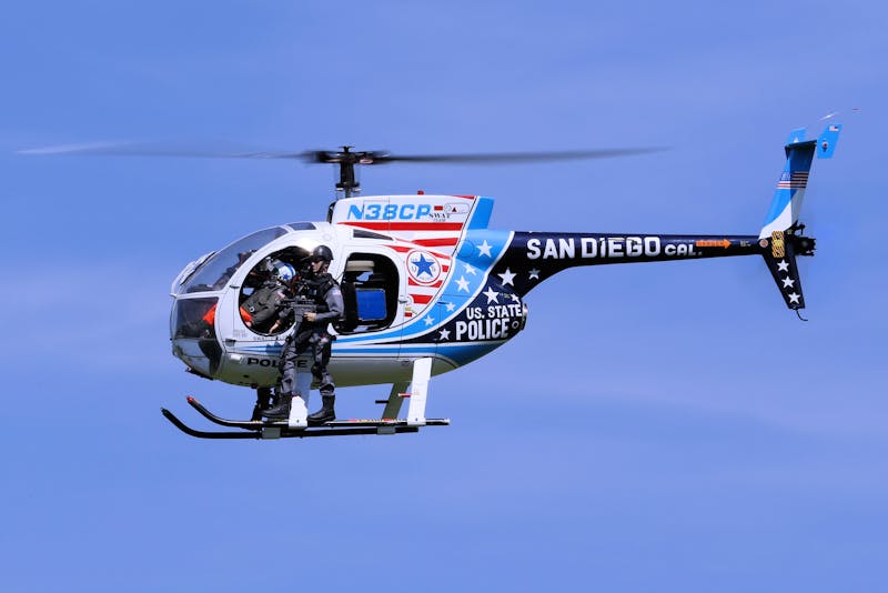 Functional Strength Through Calisthenics: Unlocking Your Full Potential 6 swat helicopter with swat member standing on running boards